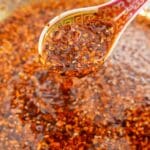 Chinese Chili oil in a bowl with a spoon.