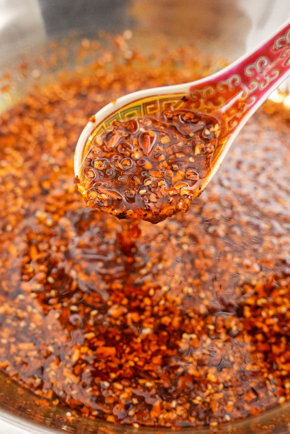 Chinese Chili oil in a bowl with a spoon.