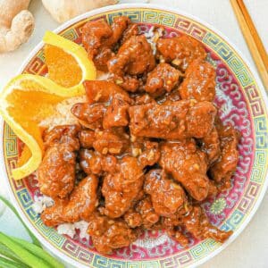 Orange Chicken on a plate with rice.