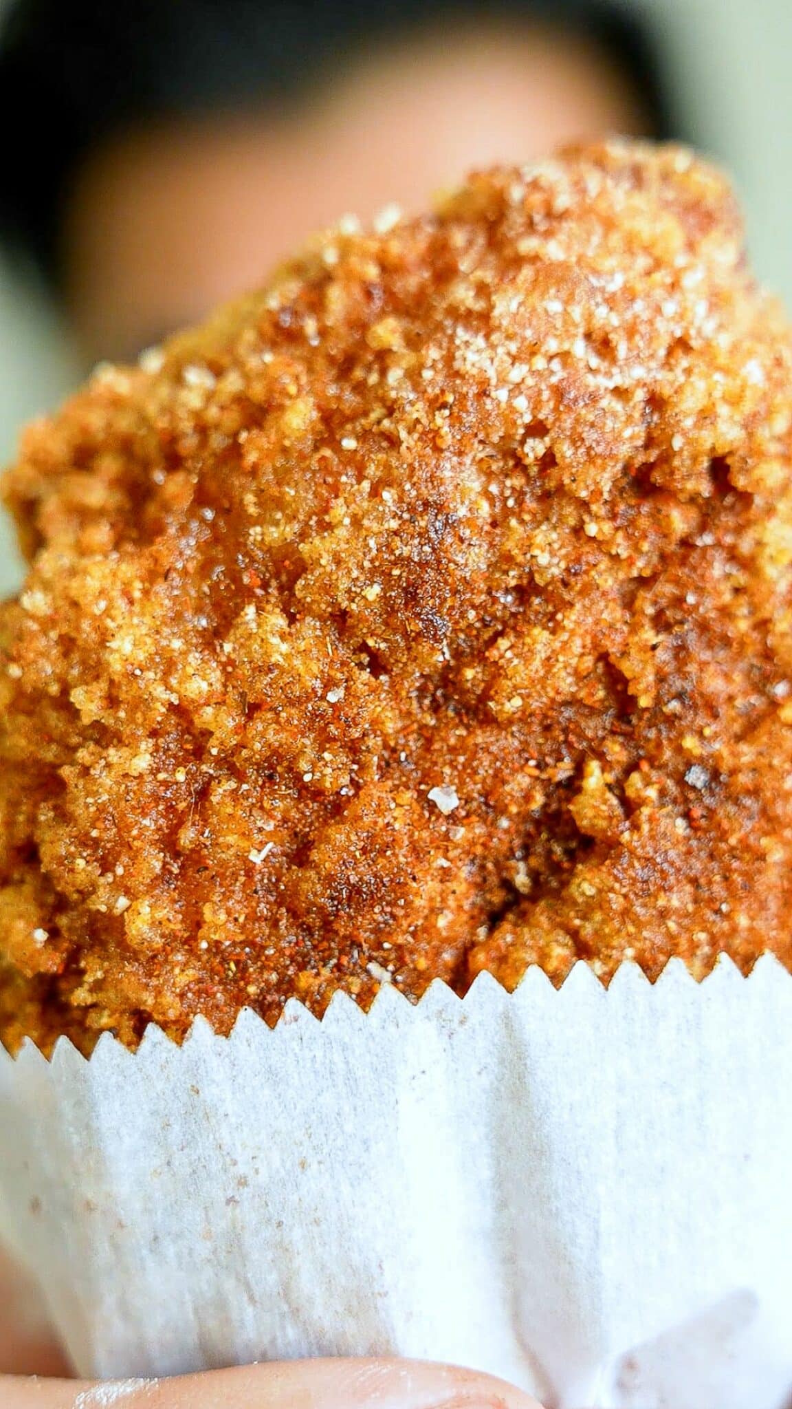 A Taiwanese XXL fried chicken cutlet in a white paper wrapper.