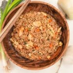 Copycat Benihana Fried Rice in a wooden bowl with chopsticks.