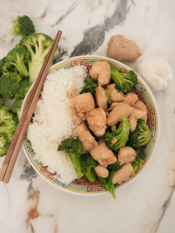 Chicken and Broccoli on a plate with rice.
