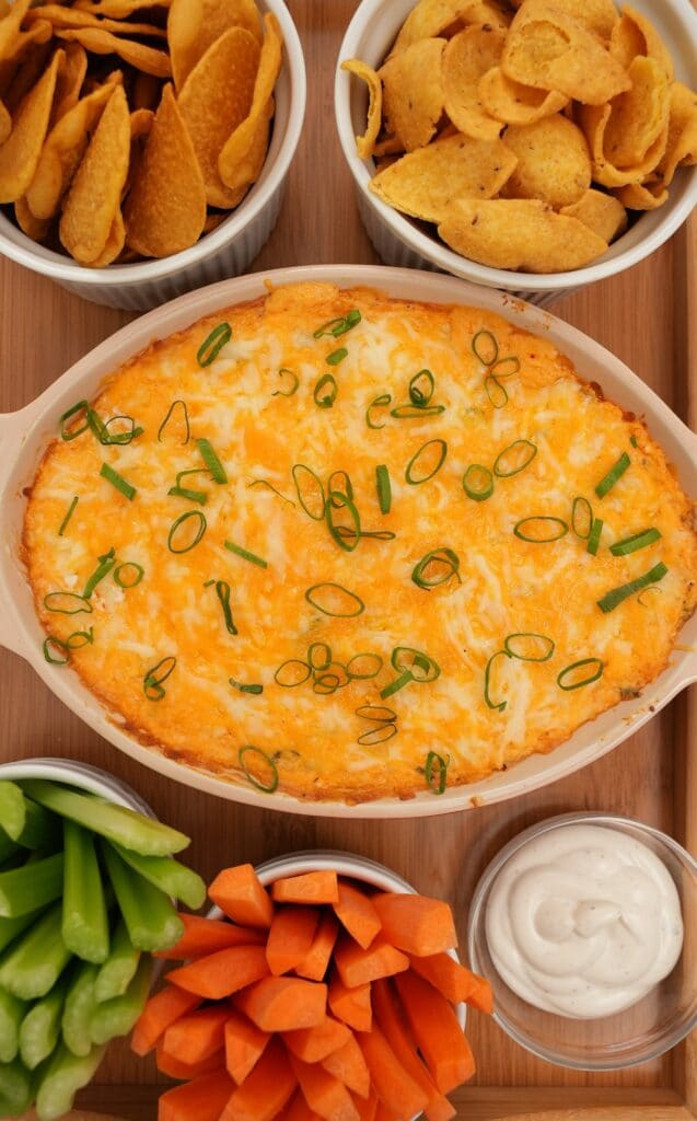 Close Up of Buffalo Chicken Dip with chips and vegetables