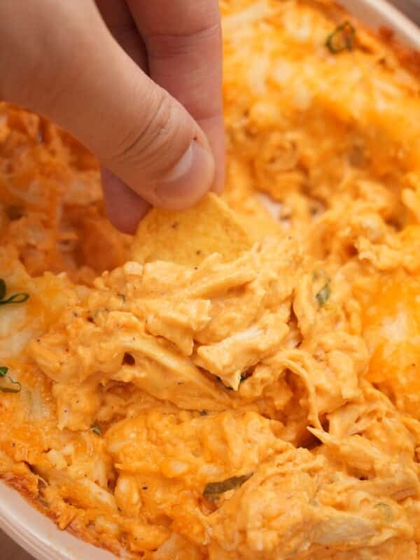 Scooping Buffalo Chicken Dip with chips