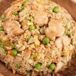 Chicken Fried Rice plated in a wooden bowl