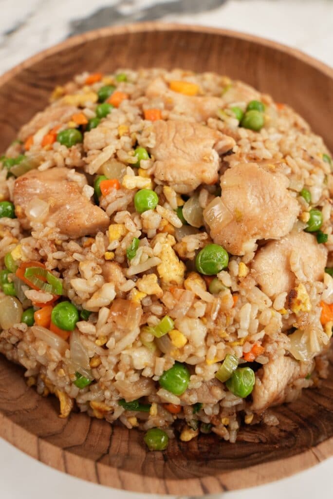 https://cjeatsrecipes.com/wp-content/uploads/2022/04/Chicken-Fried-Rice-6.-Final-2-min-684x1024.jpg