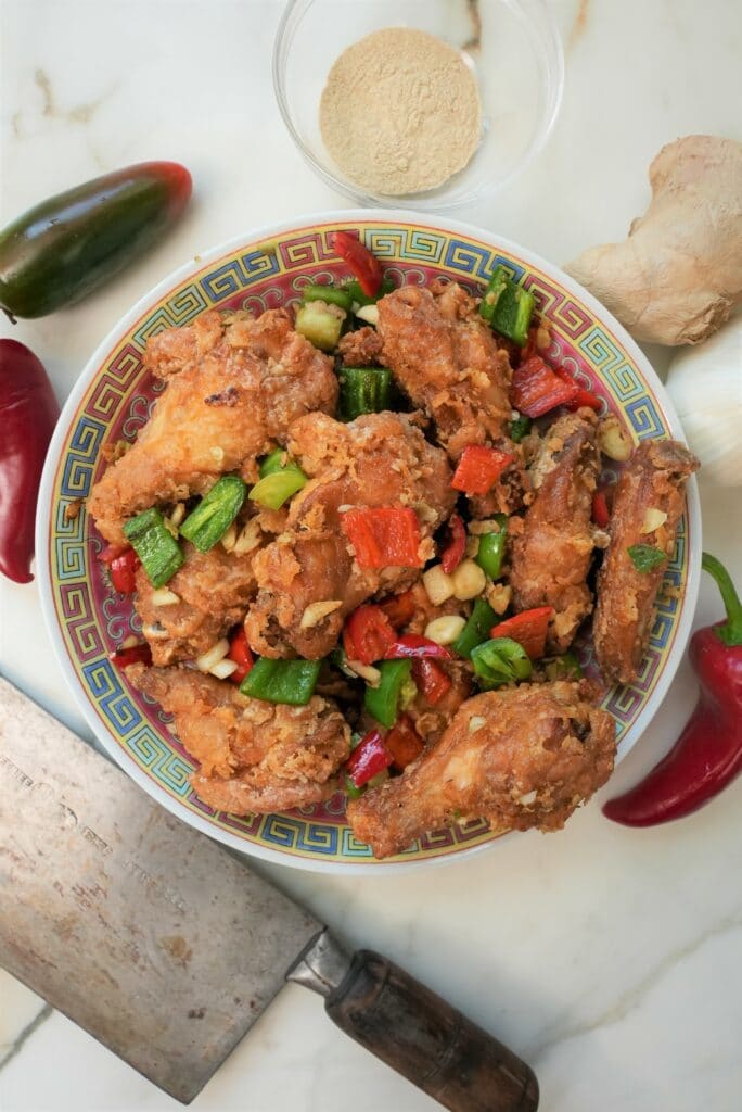 Chinese salt and pepper chicken wings on a plate.