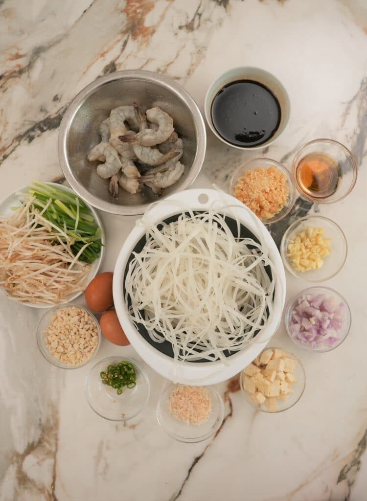Raw ingredients for Pad Thai on a table.