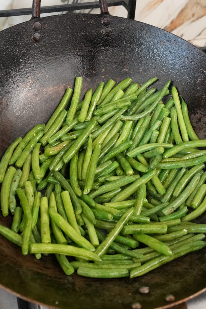 green beans cooking in a pan