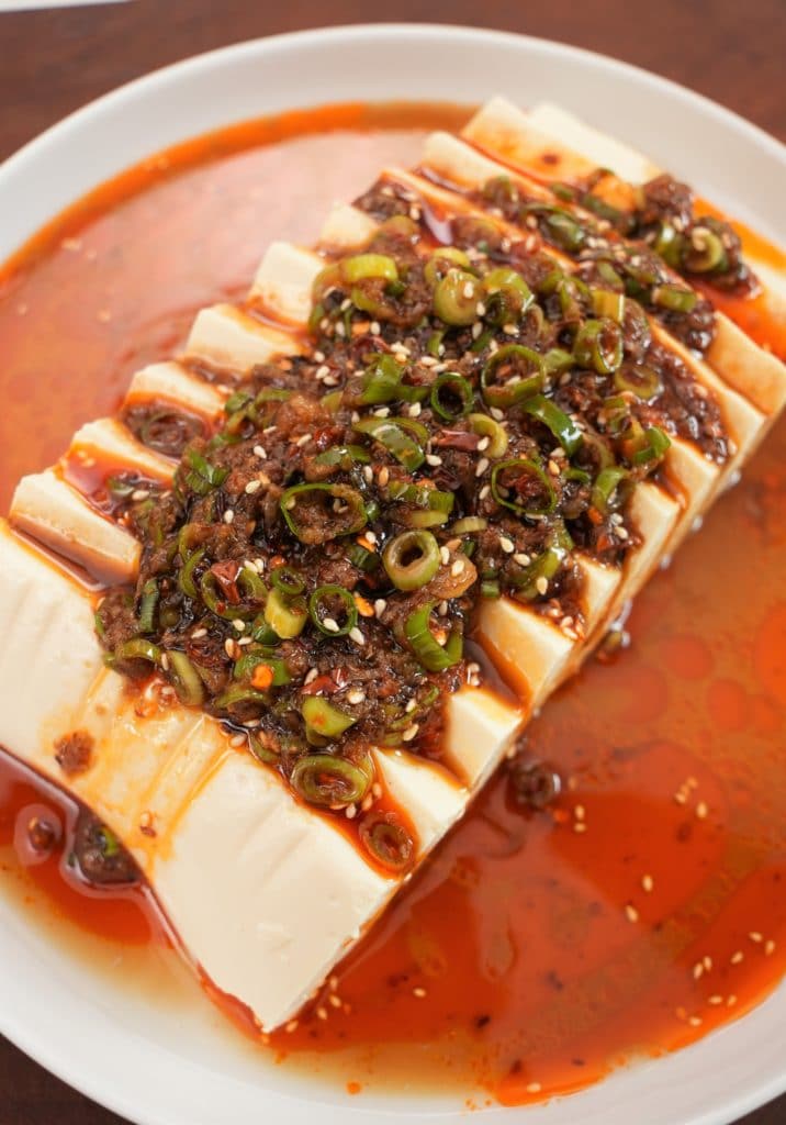 Chinese Silken Tofu sliced on a plate.