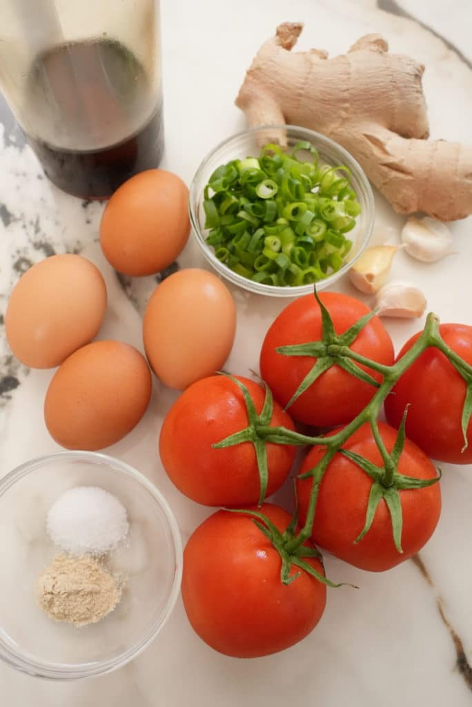 Raw ingredients for Chinese tomato egg stir fry.