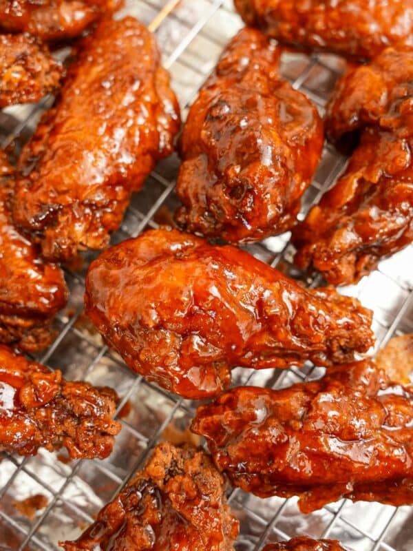 Crispy Honey Sriracha Wings on a wire rack.