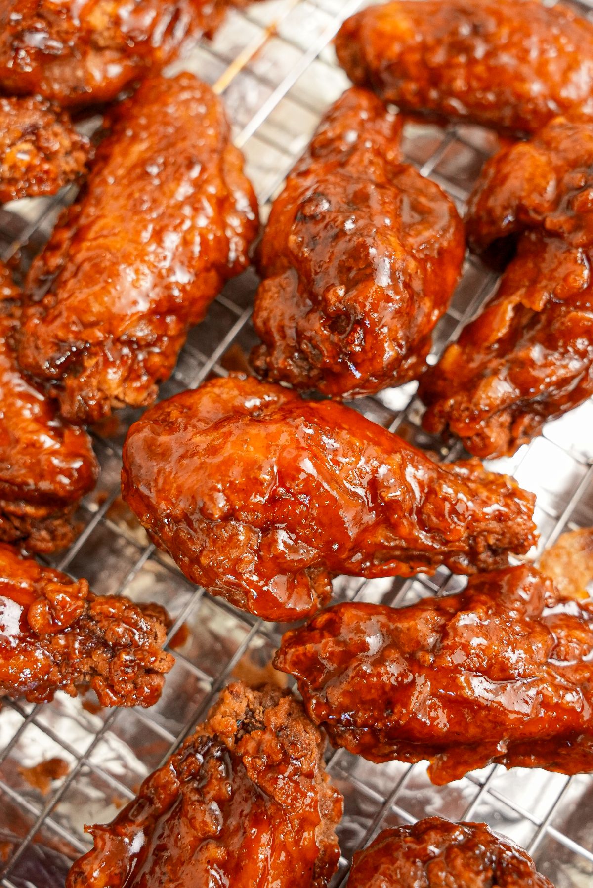Crispy Honey Sriracha Wings on a wire rack.