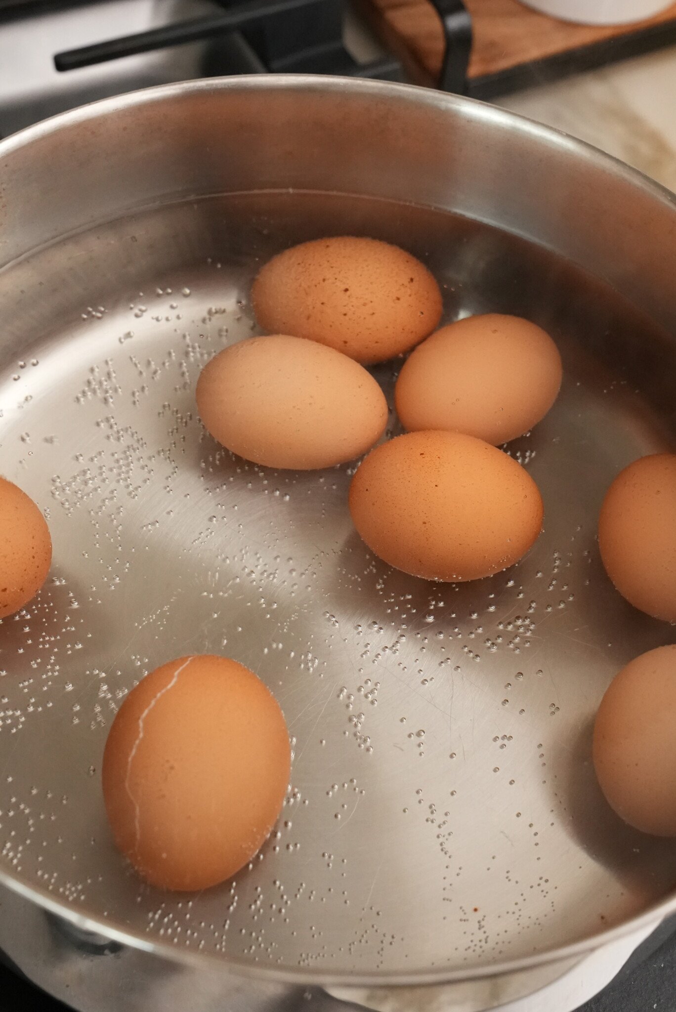 Eggs boiling in water.