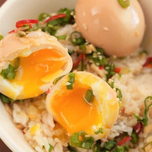Korean Marinated eggs over rice in a bowl