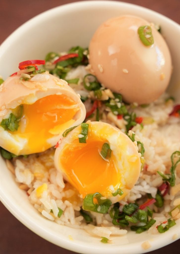 Korean Marinated eggs over rice in a bowl