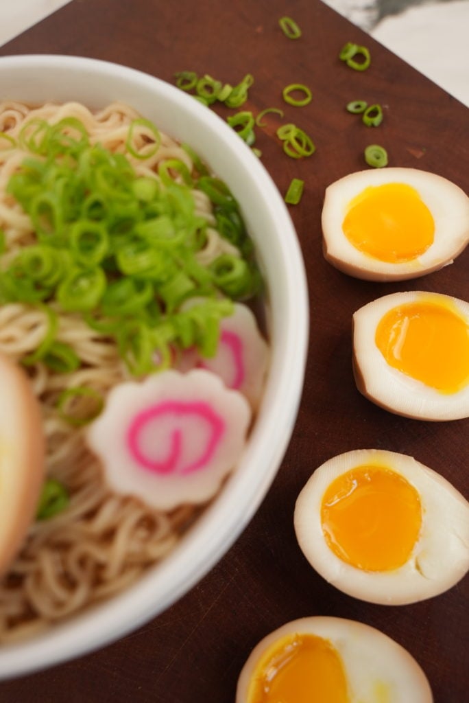 ramen eggs on a cutting board