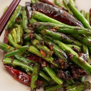 Spicy Sichuan Green Beans in a bowl with chopsticks.