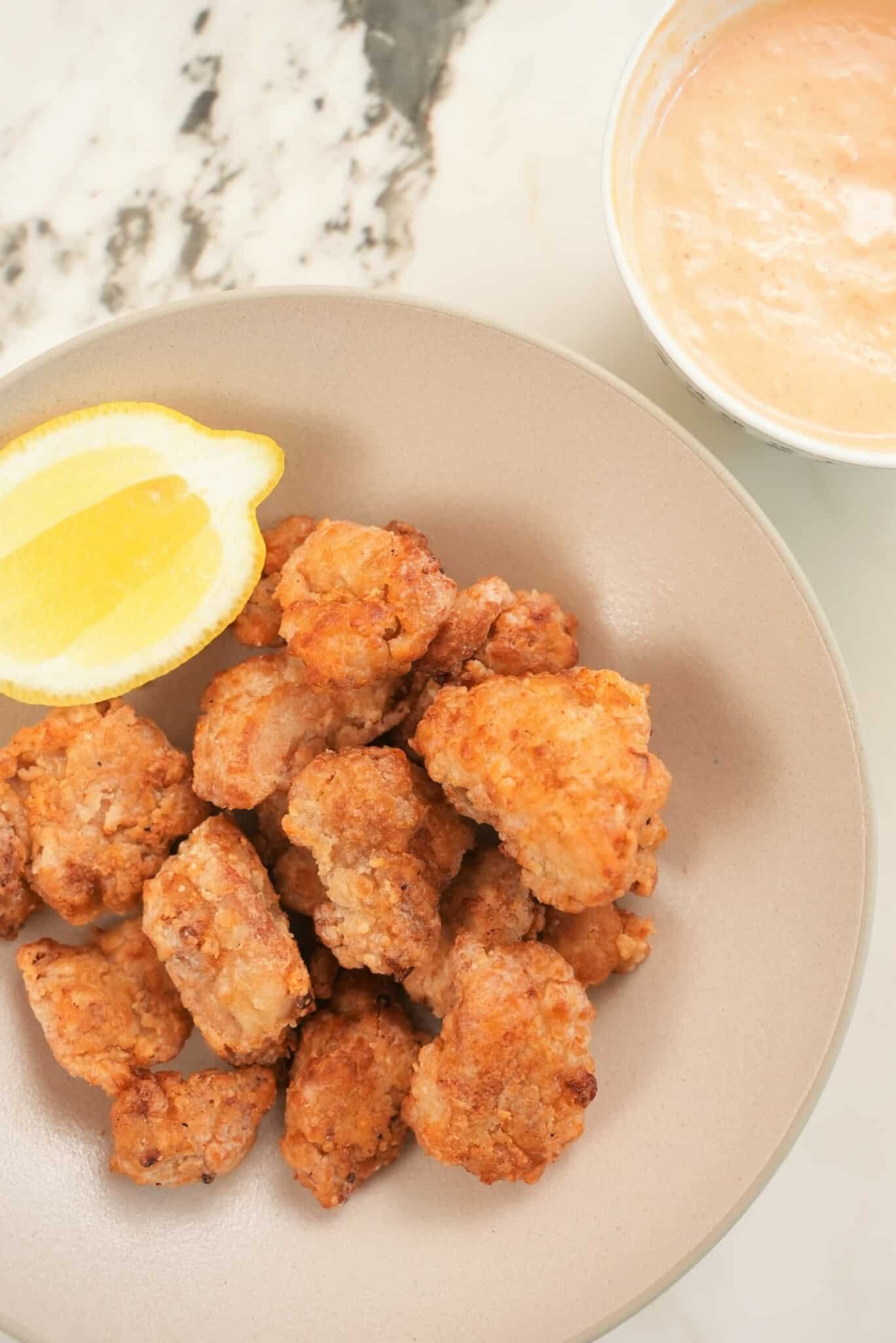 https://cjeatsrecipes.com/wp-content/uploads/2022/07/Air-Fryer-Chicken-Karaage-Japanese-Fried-Chicken-Plated-With-Sauce-scaled.jpg