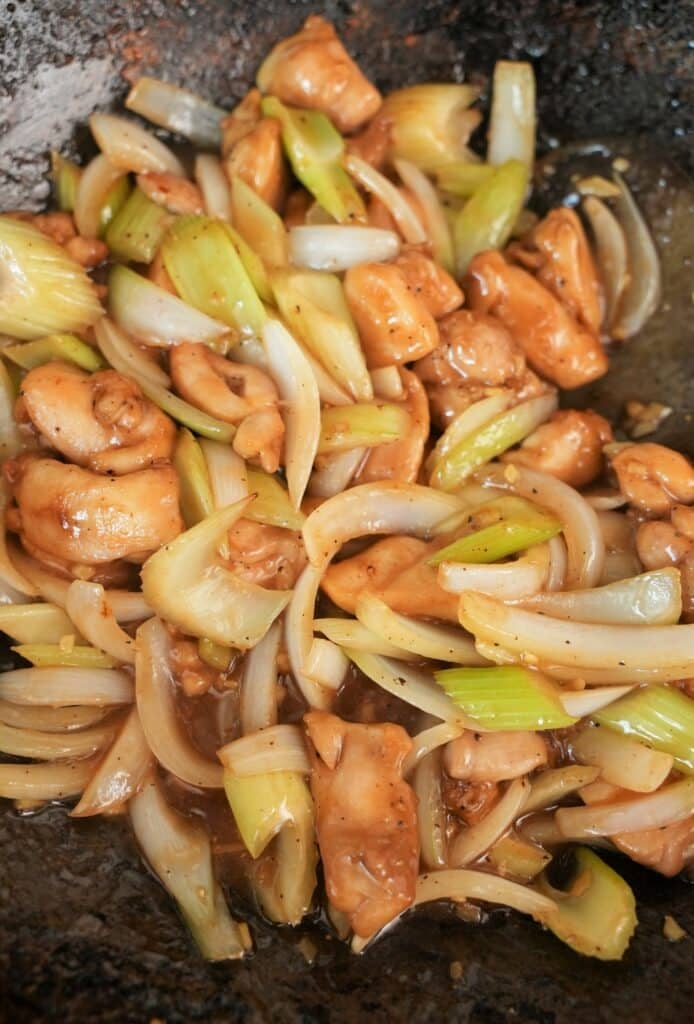 Cooked Black Pepper Chicken in a wok.