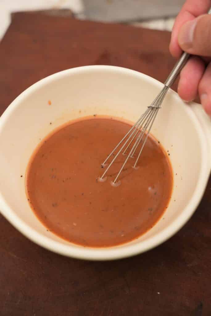 Mixing black pepper chicken sauce.