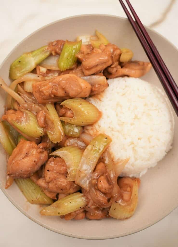 black pepper chicken on a plate with rice