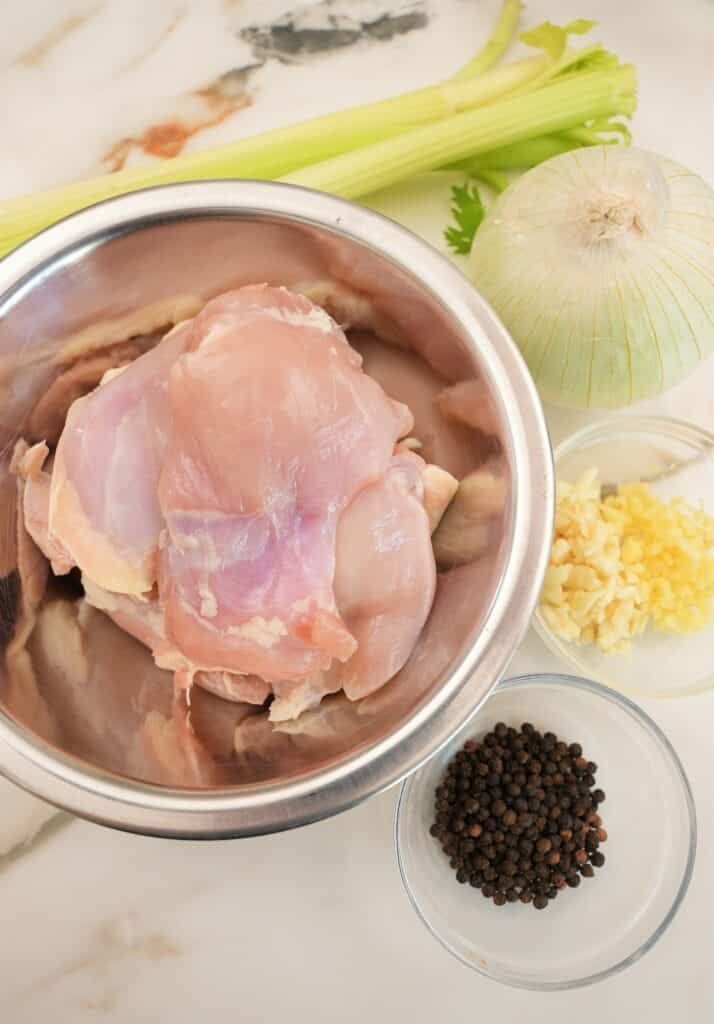 Raw ingredients for Black Pepper Chicken on a table.