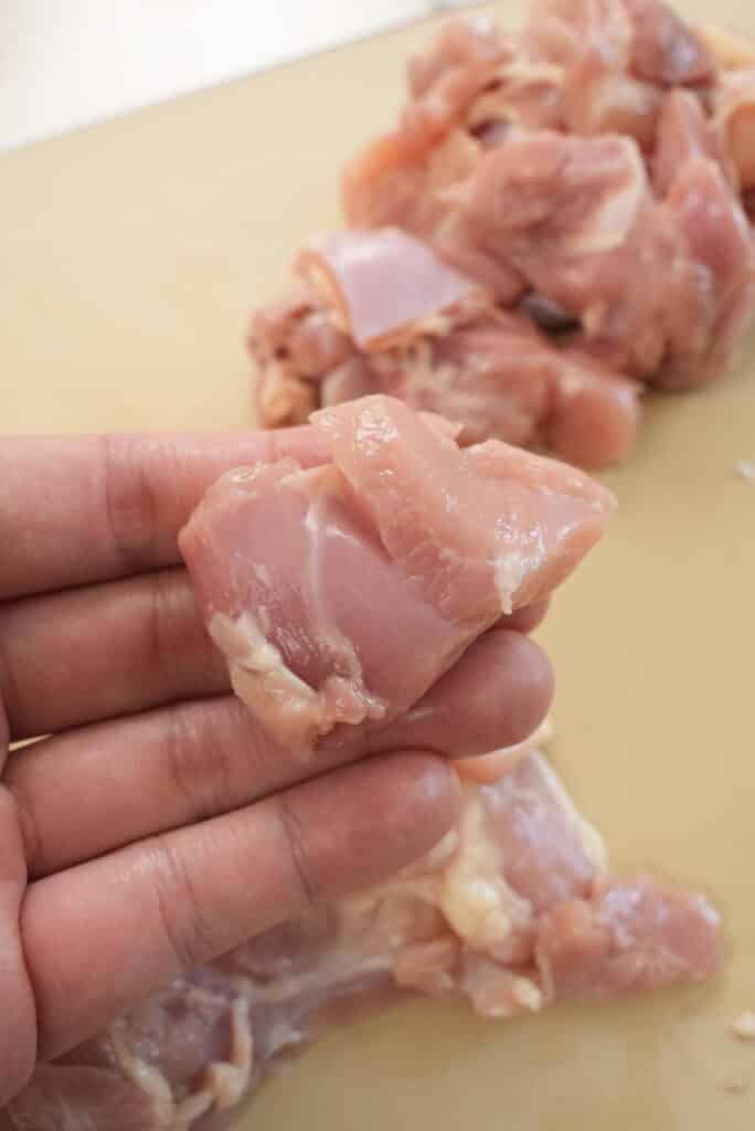 Raw chicken thigh cut into 2 inch pieces.