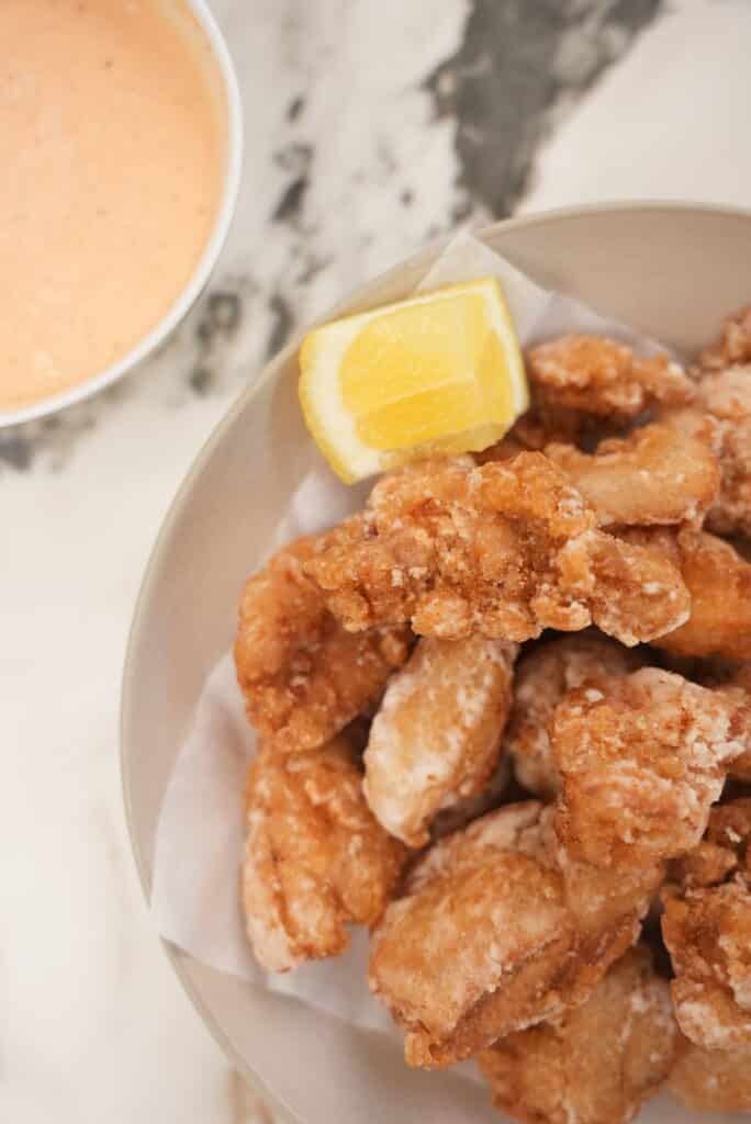 Close Up of Chicken Karaage in a grey bowl with Spicy Mayo in a small bowl.