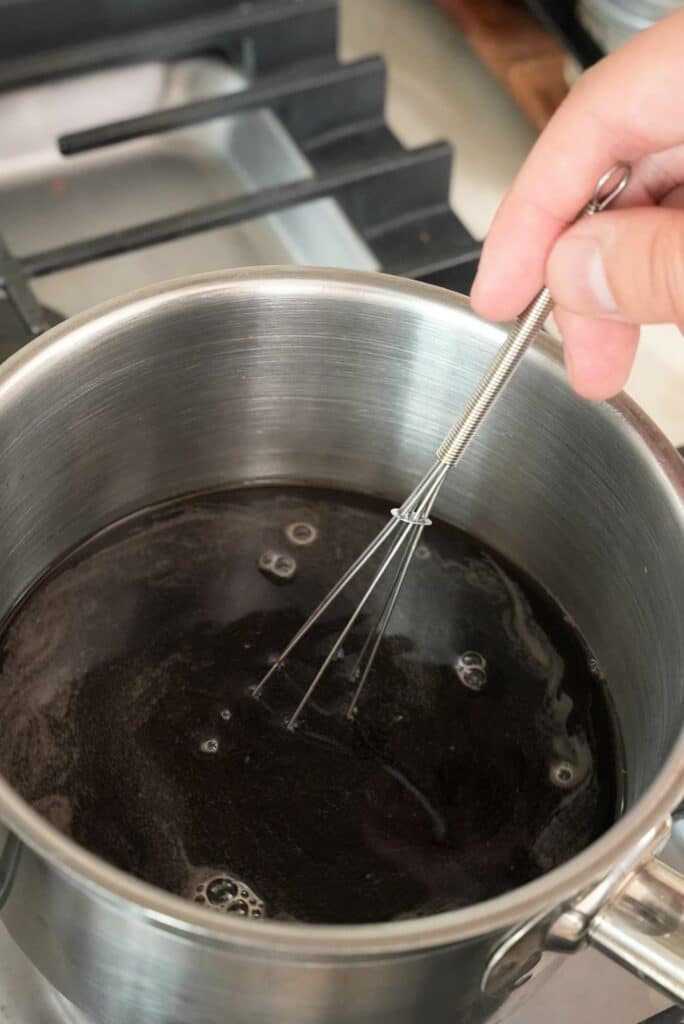 mixing soba noodle sauce in pot