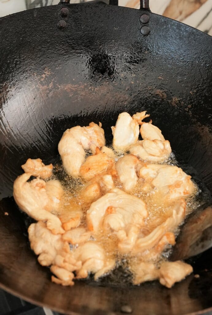 Chicken cooking in a wok