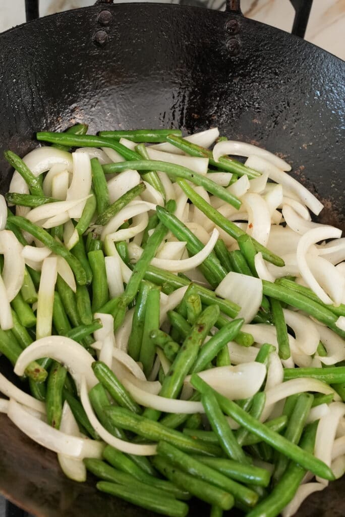 String Beans and Onions cooking in a wok