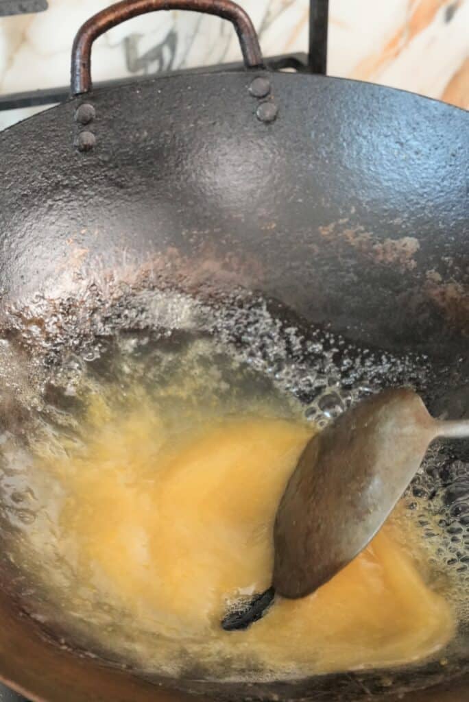 Heating lemon sauce in a pan