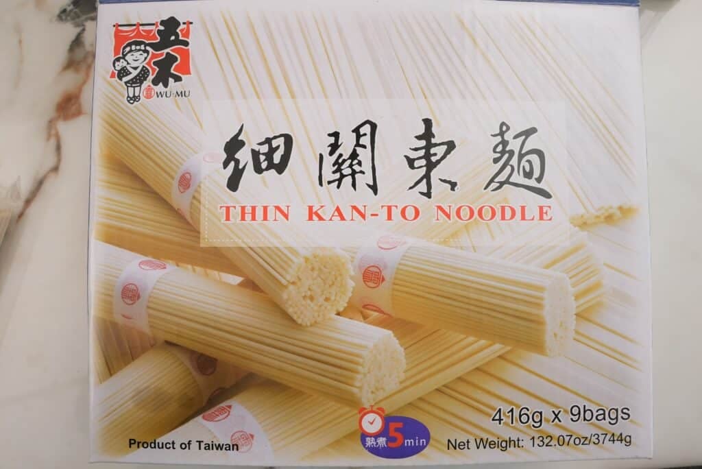 Dried wheat noodles in packaging.