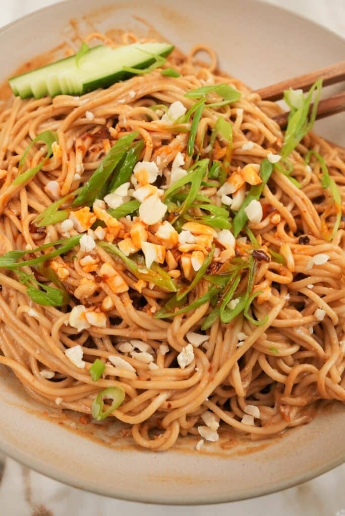 Cold Sesame noodles plated in a bowl.