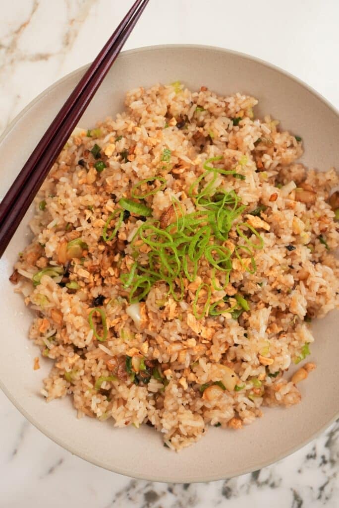 Garlic fried rice plated in a bowl.