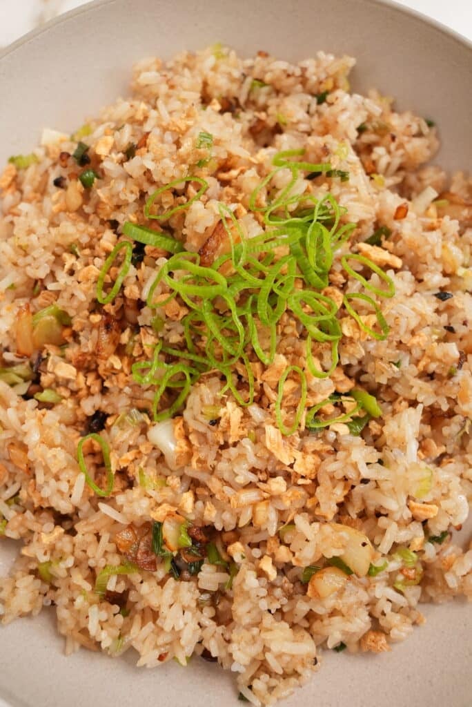 Close up of garlic fried rice in a bowl.