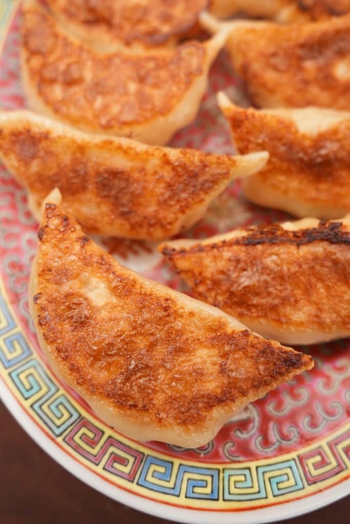 Pan fried dumplings on a plate