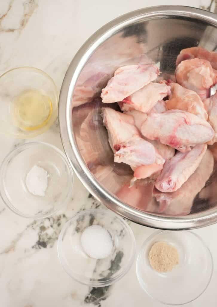 Air Fryer chicken wings raw ingredients in bowls