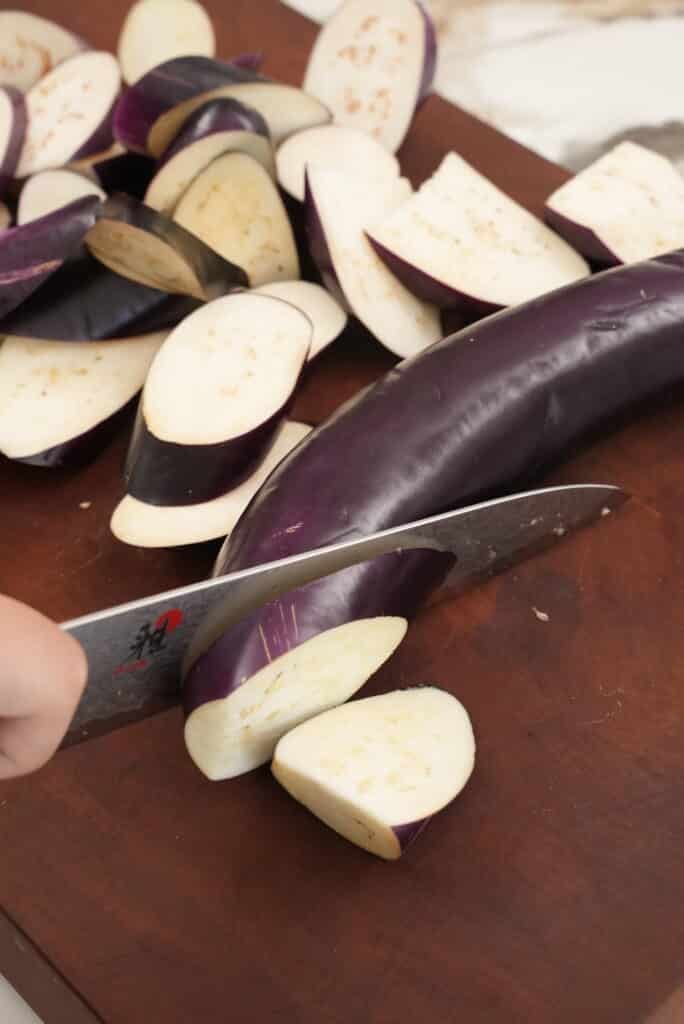 Cutting eggplant into pieces
