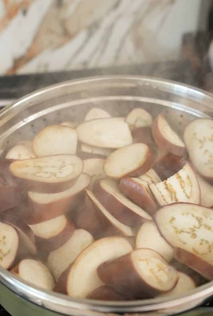 Steaming chinese eggplant in a steamer.