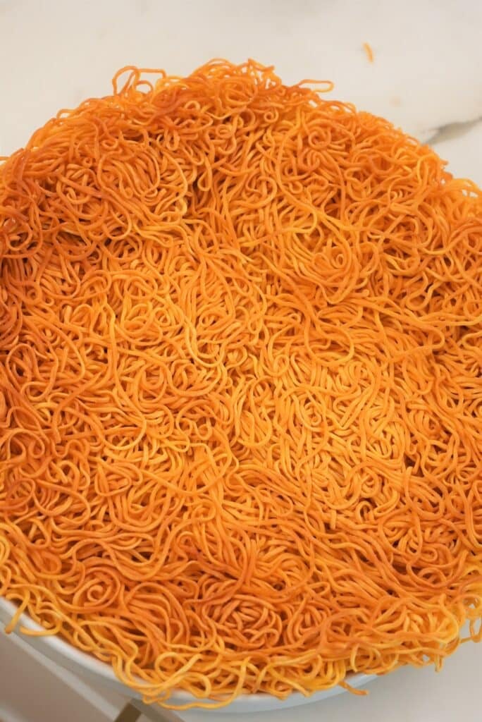 Crispy pan fried chow mein noodles on a plate