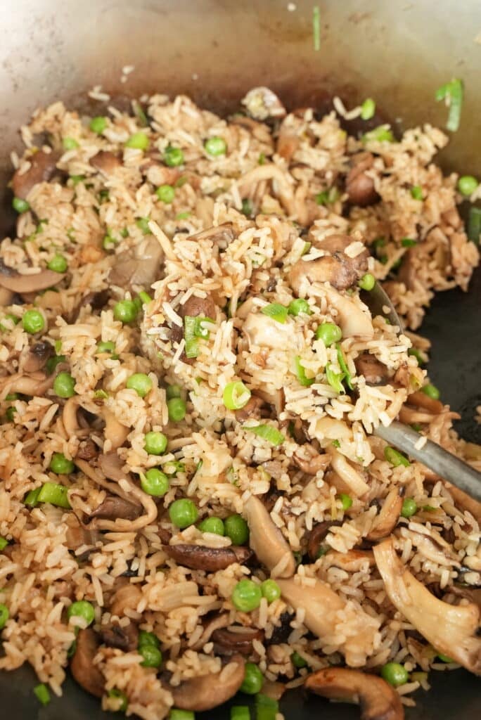 Mushroom fried rice cooked in a wok