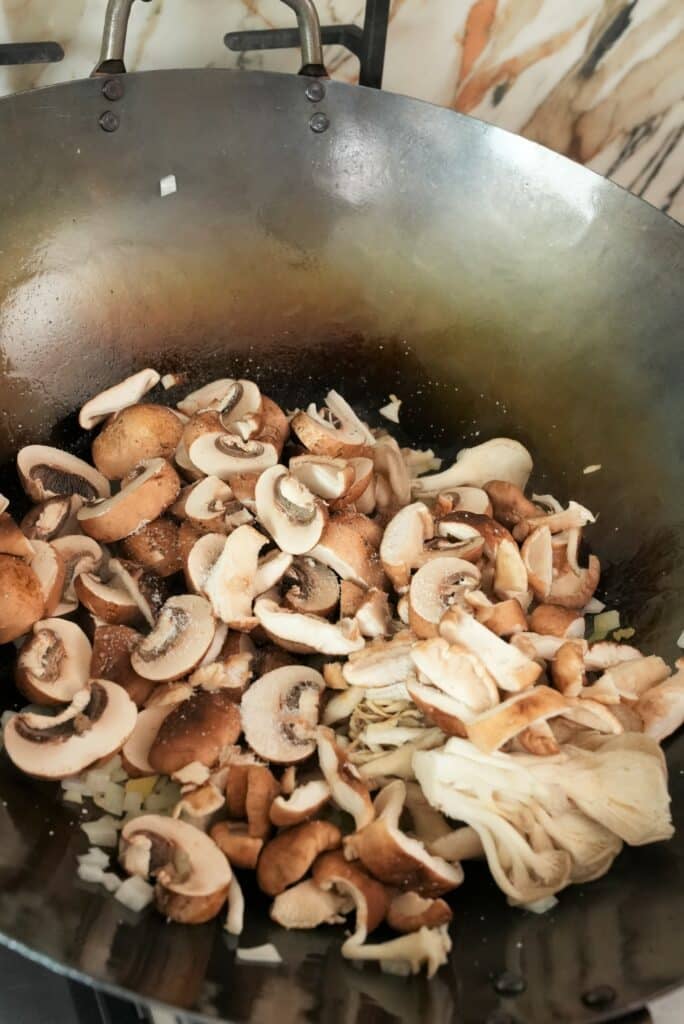 Cooking mushrooms in a wok