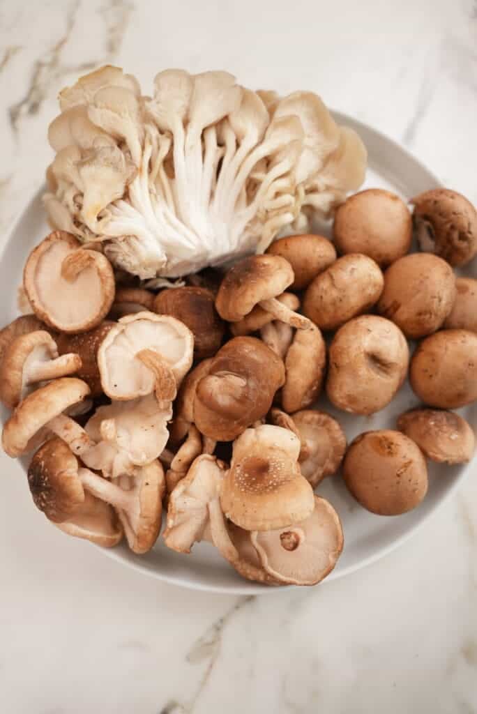raw mushrooms on a plate