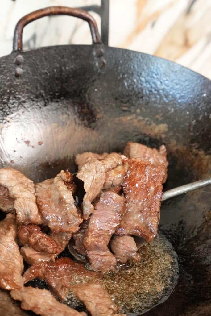 cooking beef in a wok