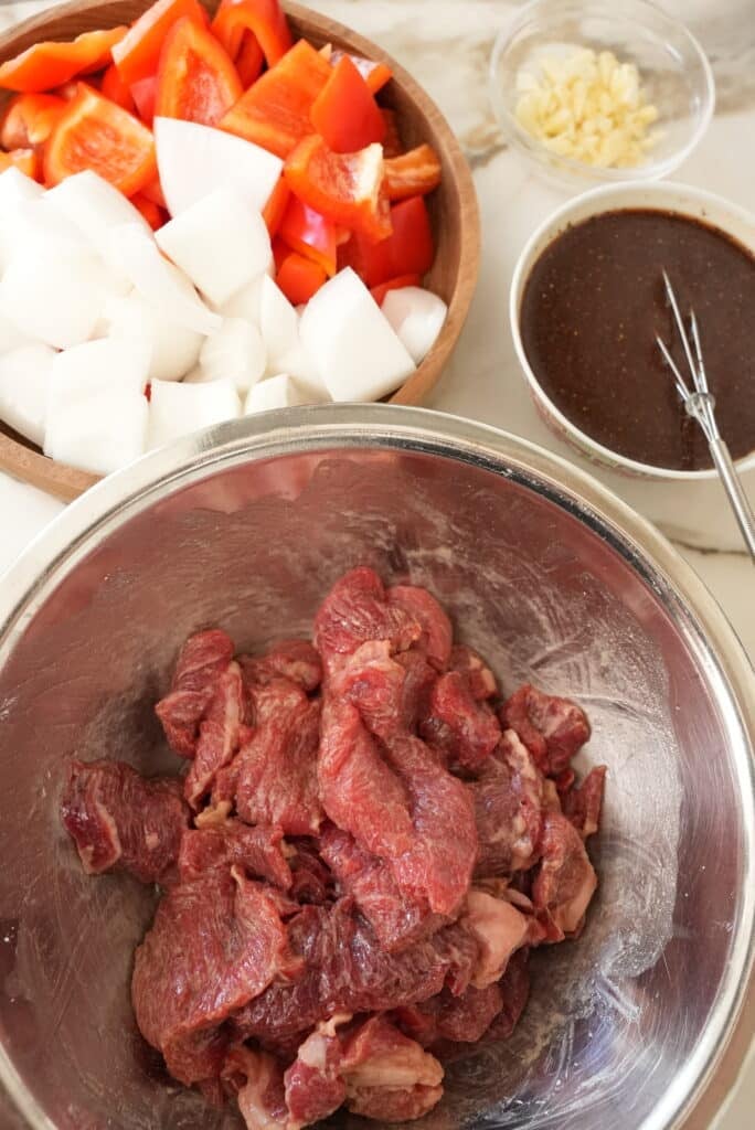 raw ingredients prepped for black pepper beef