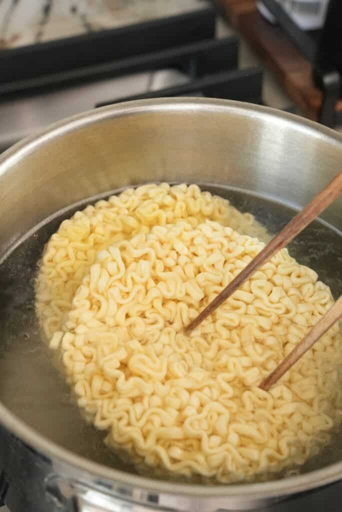 cooking ramen in boiling water