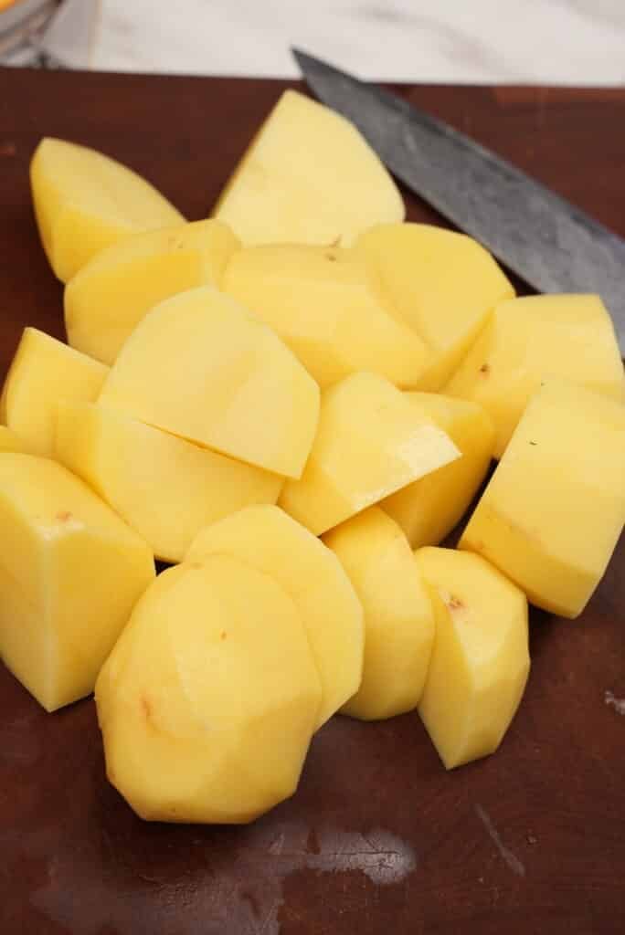 diced raw potatoes on a cutting board