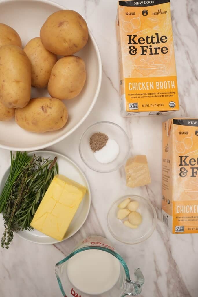 Raw ingredients for Mashed potatoes on a table.